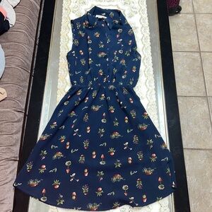 Navy blue sleeveless button front dress with houseplant print